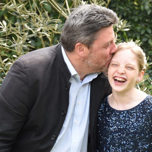 Adeline laughing with her father